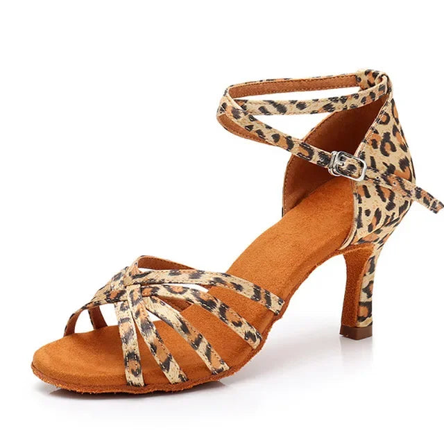 Brown dance shoe with leopard print straps on a white background